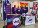 Four Volters behind their colourful stand