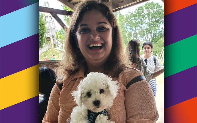 Lara holding a white dog